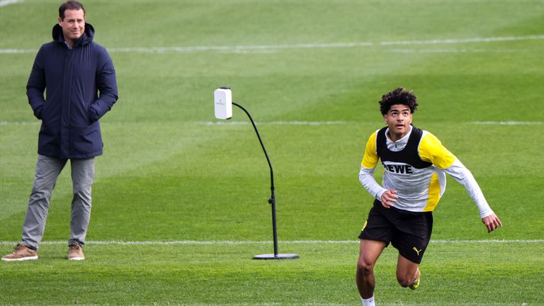 Borussia Dortmund chief  Lars Ricken watches on as Mathis Albert trains