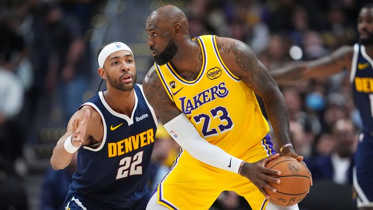 LeBron James looks to pass as Zeke Nnaji defends  (AP Photo/David Zalubowski)