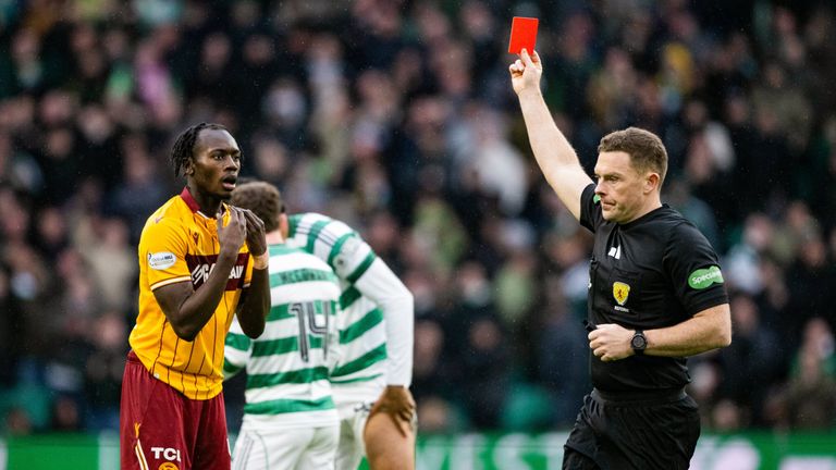 Referee John Beaton shows Motherwell's Emmanuel Longelo a red card 