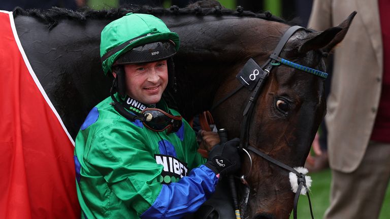 Nico de Boinville celebrates with Old Park Star after winning the Supreme Novices' Hurdle on the first day of the Cheltenham Festival