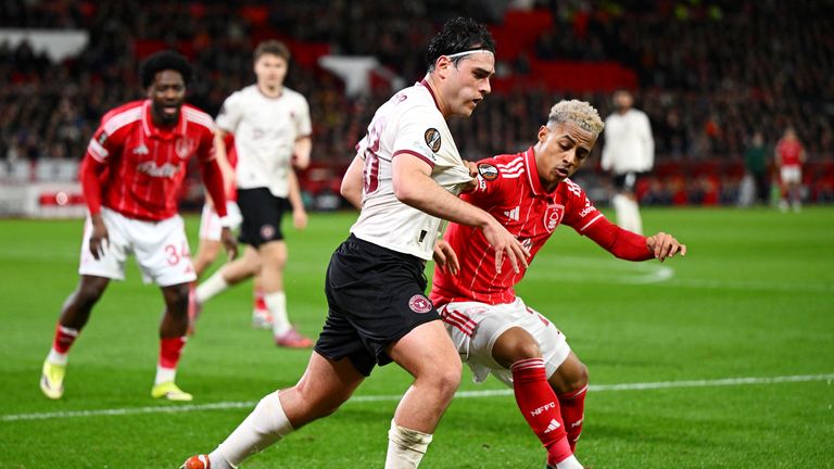 Omari Hutchinson battles for the ball for Nottingham Forest