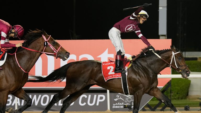 Jockey Jose Ortiz, aboard Magnitude celebrates winning the $12 million Dubai World Cup horse race over at Meydan (AP Photo/Altaf Qadri)