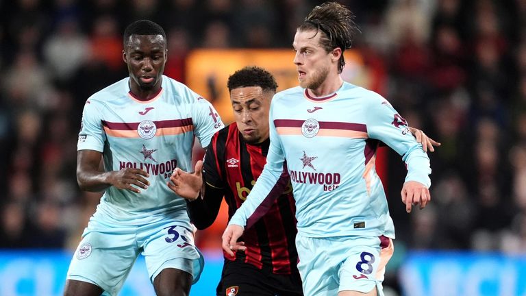 Michael Kayode and Mathias Jensen combine to thwart Marcus Tavernier