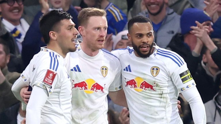Sean Longstaff celebrates with his team-mates after scoring Leeds' opening goal against Norwich