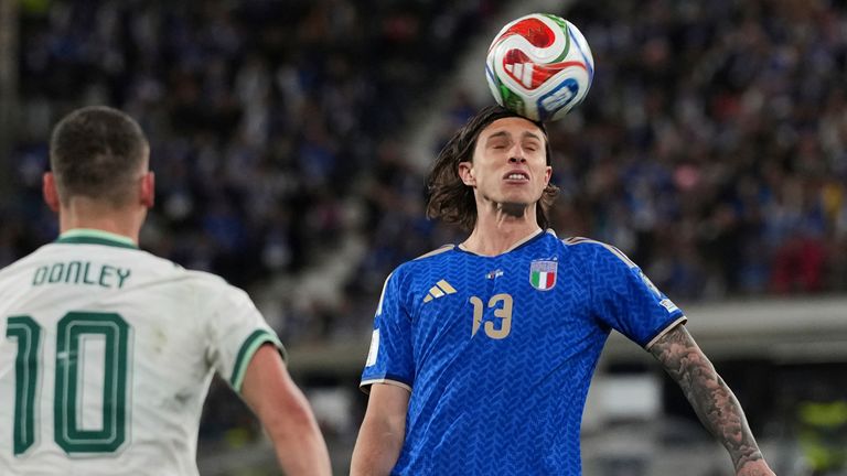 Italy's Riccardo Calafiori and Northern Ireland's Jamie Donley vie for the ball (AP Photo/Antonio Calanni)