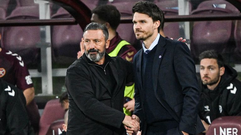 EDINBURGH, SCOTLAND - DECEMBER 21: Hearts Head Coach Derek McInnes (L) shakes hands with Rangers Head Coach Danny Rohl during a William Hill Premiership match between Heart of Midlothian and Rangers at Tynecastle Park, on December 21, 2025, in Edinburgh, Scotland. (Photo by Rob Casey / SNS Group)