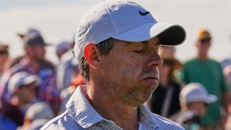 Rory McIlroy of Northern Ireland reacts to his shot off the third tee during the third round of The Players 