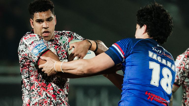 Jacob Alick-Wiencke of Leigh is tackled by Isaiah Vagana of Wakefield