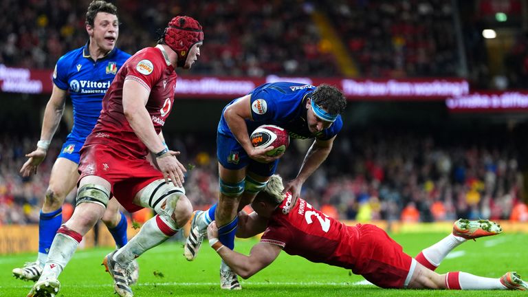 Italy's Michele Ramaro is tackled by Wales' Blair Murray