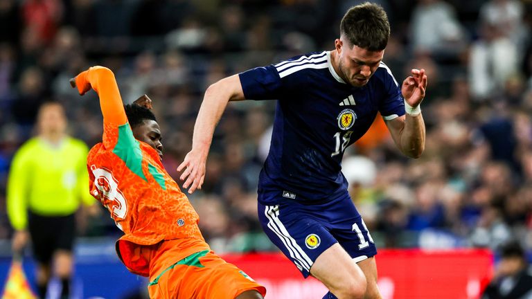 LIVERPOOL, ENGLAND - MARCH 31: Scotland's George Hirst and Ivory Coast's Christ Inao Oulai in action during an International Friendly match between Cote d'Ivoire and Scotland at the Hill Dickinson Stadium, on March 31, 2026, in Liverpool, England. (Photo by Craig Williamson / SNS Group)