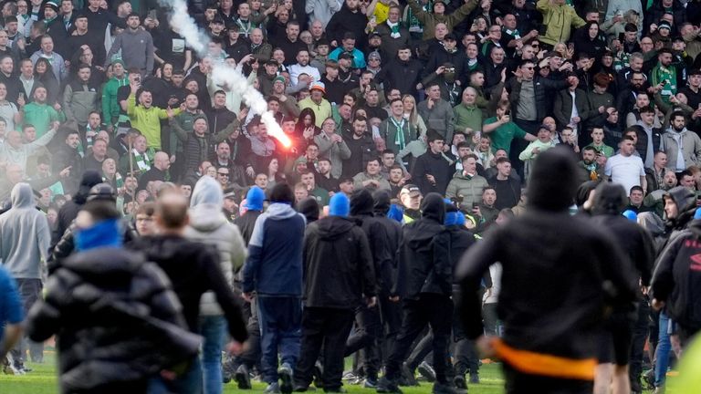 Fans invade the pitch at Ibrox as ugly scenes mar Celtic's Scottish Cup win against Rangers