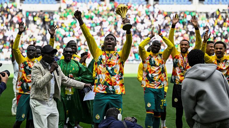 Senegal's players parade with the AFCON trophy ahead of the international friendly against Peru in Paris