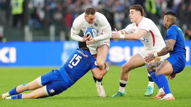 Tom Roebuck is tackled by Lorenzo Pani