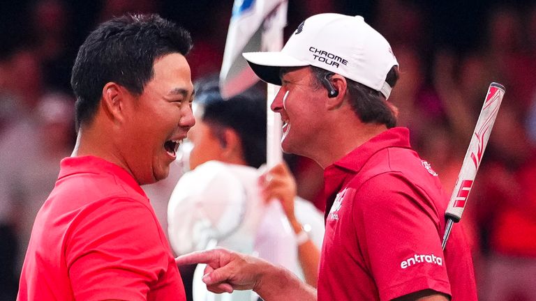 Tom Kim and Kevin Kisner of Jupiter Links GC react after defeating The Bay Golf Club in TGL