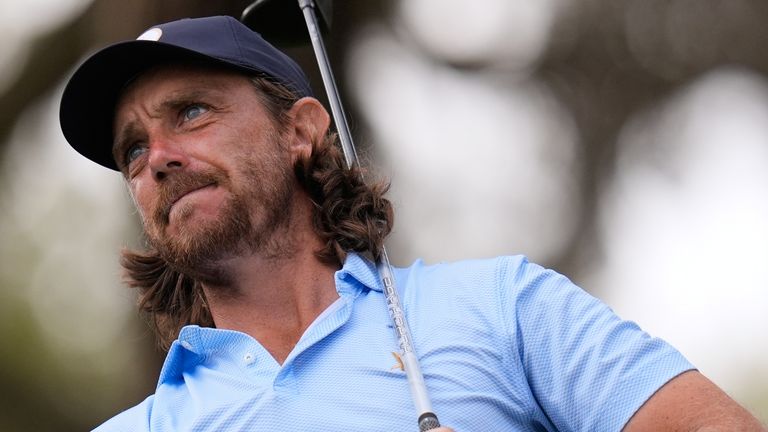 Tommy Fleetwood of England reacts to his tee shot on the 12th hole during the first round of The Players Championship golf