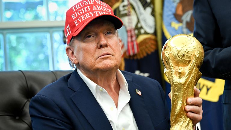US President Donald Trump holds the FIFA World Cup