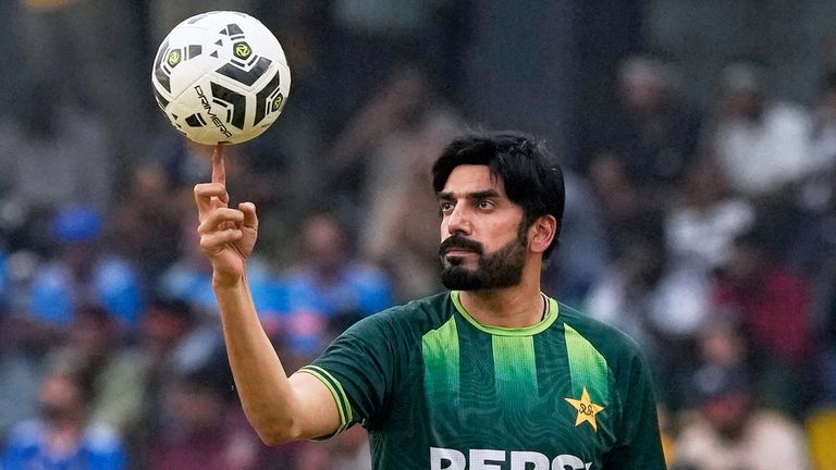 Pakistan's Usman Tariq balances a soccer ball on his finger as he warms up before the start of the T20 World Cup cricket match between India and Pakistan in Colombo, Sri Lanka, Sunday, Feb. 15, 2026. (AP Photo/Eranga Jayawardena)