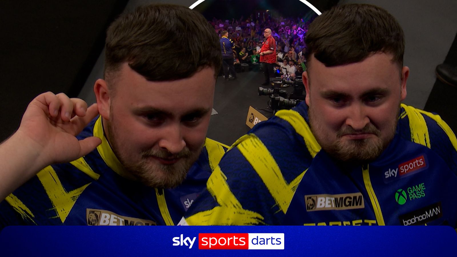 Luke Littler responds to the crowd after hearing boos during his walk-on in Brighton