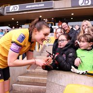 Anna Morphet of Wolverhampton Wanderers signs autographs after a game against West Brom in March 2026