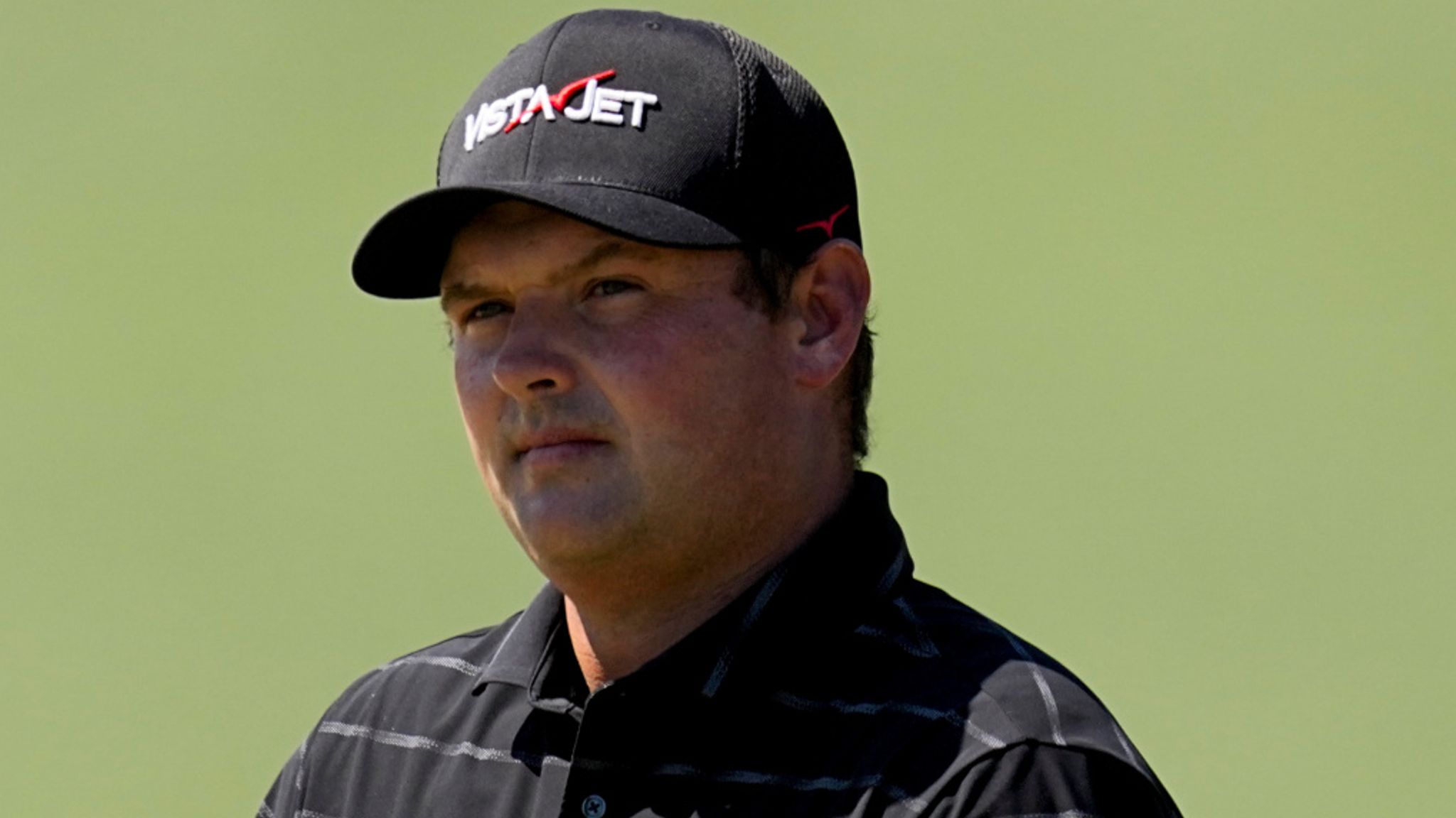 Patrick Reed waves after his putt on the second hole during the third round of the Masters golf tournament at the Augusta