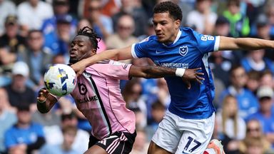 Portsmouth goalscorer Ibane Bowat tangles with Abdul Fatawu