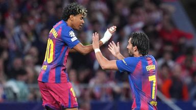 Barcelona's Lamine Yamal, left, celebrates with Barcelona's Ferran Torres after scoring the opening goal during the Champions League quarterfinal second leg soccer match between Atletico Madrid and Barcelona in Madrid, Spain, Tuesday, April 14, 2026. (AP Photo/Manu Fernandez)