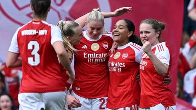 Olivia Smith of Arsenal celebrates scoring her team's second goal with team-mates