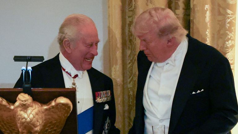 Britain's King Charles and U.S. President Donald Trump interact during a state dinner for the King and Queen Camilla at the White House in W