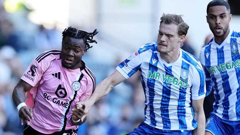Abdul Fatawu of Leicester City in action with Svante Ingelsson of Sheffield Wednesday