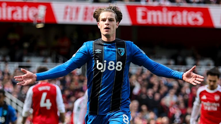 Alex Scott wheels away to celebrate his match-winning goal