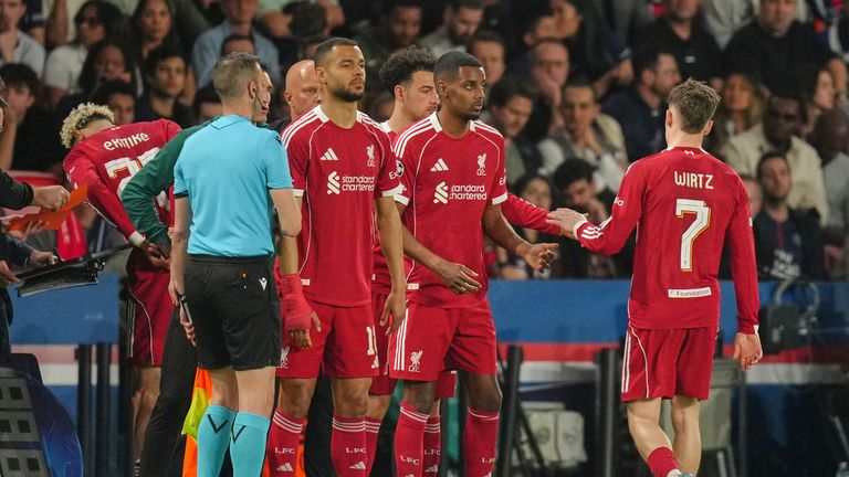 Liverpool's Alexander Isak, second right, prepares to come onto the pitch in his return from injury against PSG