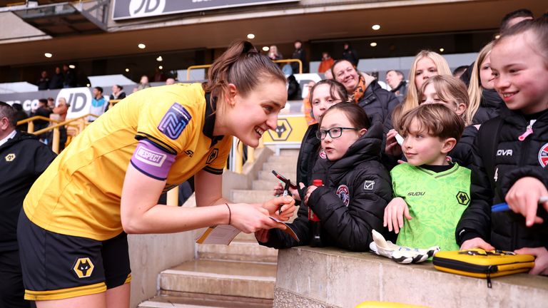 Anna Morphet of Wolverhampton Wanderers signs autographs after a game against West Brom in March 2026