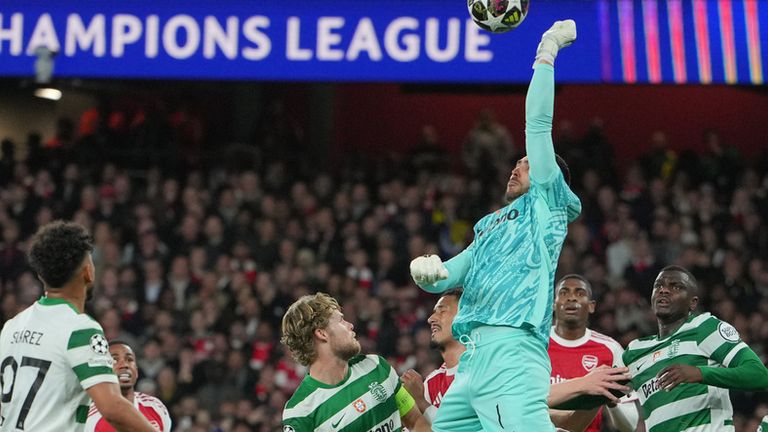 Sporting's goalkeeper Rui Silva punches the ball during the UEFA Champions League second leg quarterfinal soccer match between Arsenal and Sporting in London, England, Wednesday, April 15, 2026. (AP Photo/Kin Cheung)