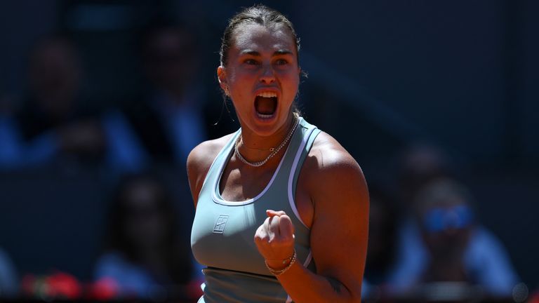 Aryna Sabalenka of Belarus celebrates winning a point against Naomi Osaka of Japan during their match on Day 8 of the Mutua Madrid Open at L