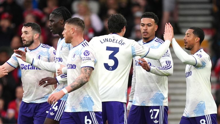 Aston Villa players celebrate taking the lead via an own goal scored by Nottingham Forest's Murillo