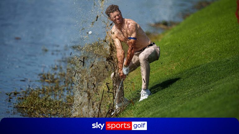 Michael Brennan sends mud and water flying as he tries to hit his ball out of floating debris on the 18th hole, only to have it land back in the water, during the first round of the PGA Zurich Classic golf tournament at TPC Louisiana, Thursday, April 23, 2026, in Avondale, La. (AP Photo/Matthew Hinton)
