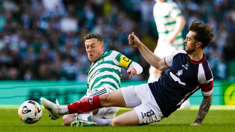 Celtic's Callum McGregor (L) and Falkirk's Brad Spencer in action at Celtic Park