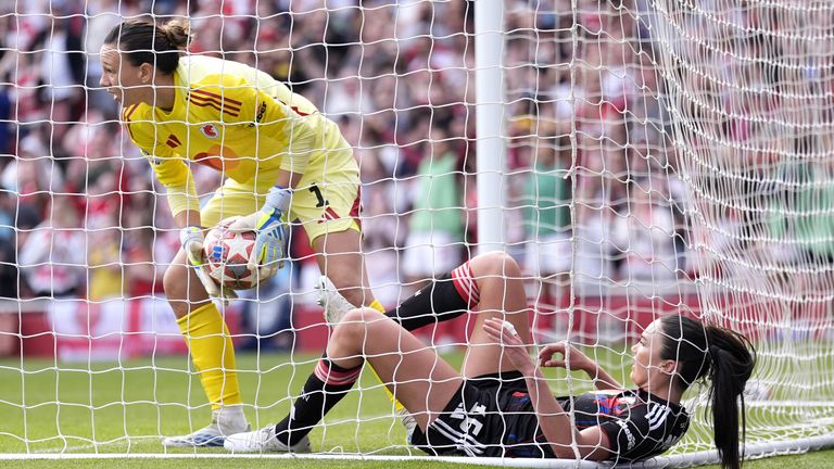 Lyon goalkeeper Christiane Endler (left) and team-mate Ingrid Engen react as Arsenal equalise
