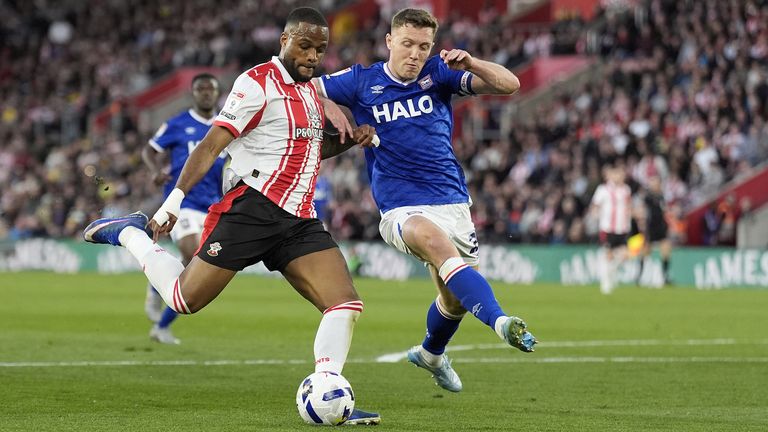Southampton's Cyle Larin tries to get a shot away under the attention of Ipswich captain Dara O'Shea