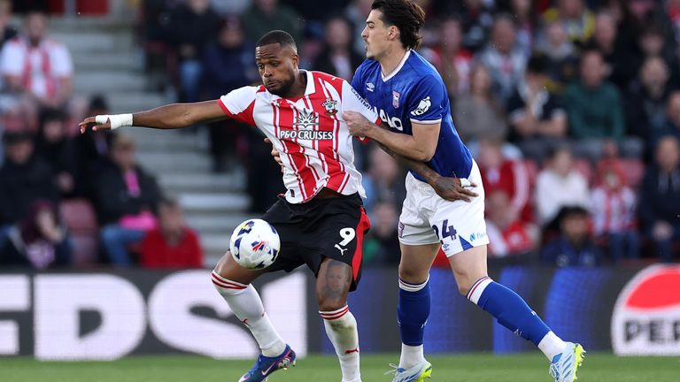 Southampton's Cyle Larin fends off Ipswich's Jacob Greaves