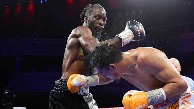 Janibek Alimkhanuly, right, dodges a punch from Denzel Bentley in the 12th round of a middleweight boxing bout Saturday, Nov. 12, 2022, in Las Vegas. Alimkhanuly won by unanimous decision. (Erik Verduzco/Las Vegas Review-Journal via AP)