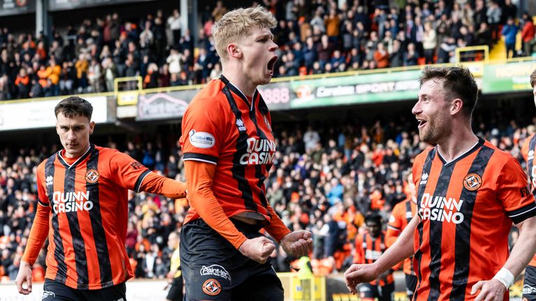 Dundee United's Zac Sapsford elebrates with Ryan Strain after his late penalty