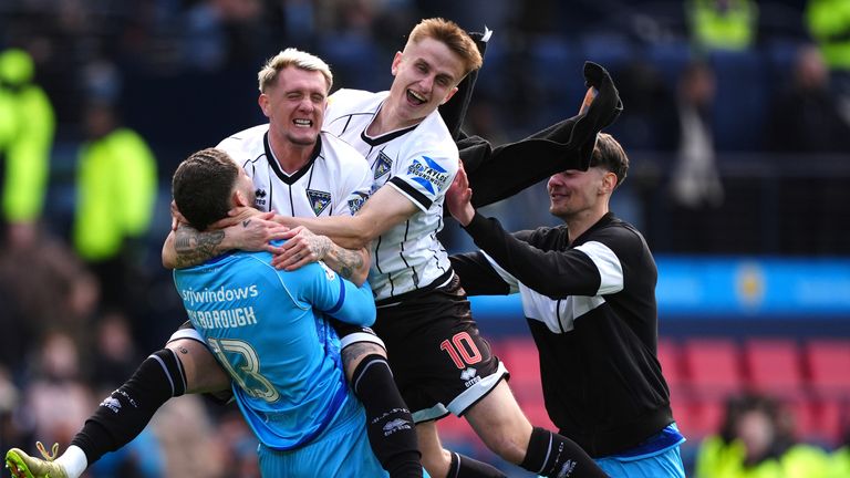 Dunfermline's players celebrate their Scottish Cup semi-final win against Falkirk 