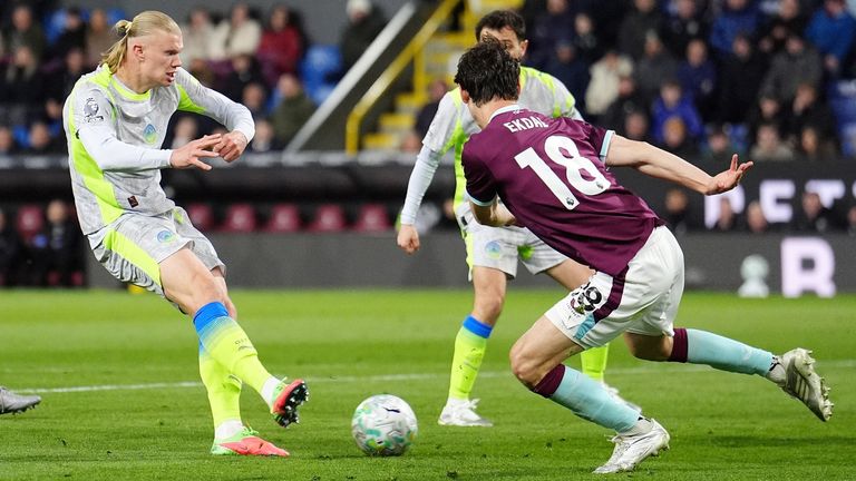 Erling Haaland takes a shot against Burnley