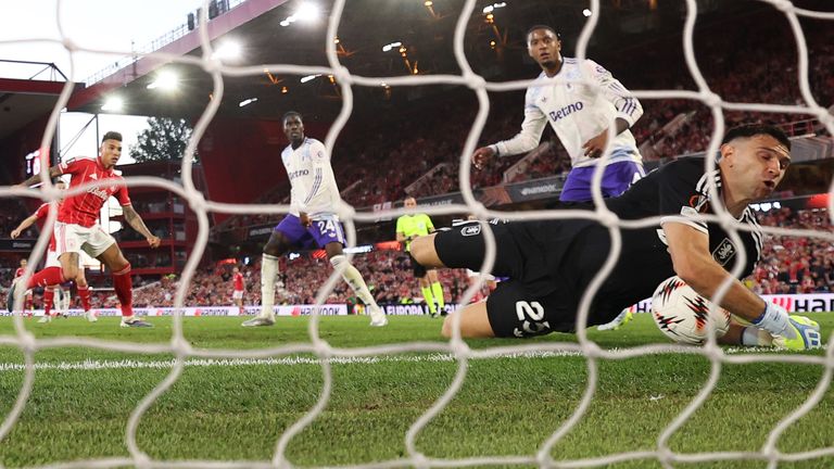 Emiliano Martinez of Aston Villa makes a save from Igor Jesus of Nottingham Forest