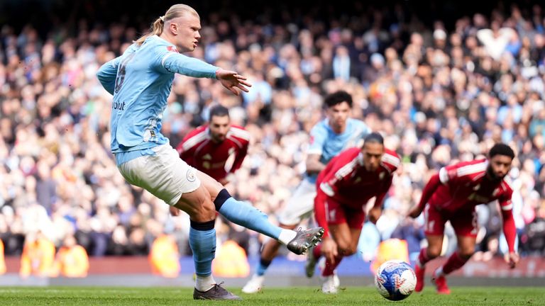 Erling Haaland converts a penalty to give Man City a first-half lead against Liverpool
