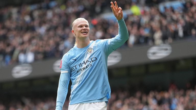 Erling Haaland celebrates after completing his hat-trick during Man City's FA Cup rout of Liverpool