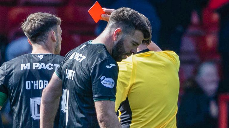 Hibernian's Grant Hanley is shown a red card 