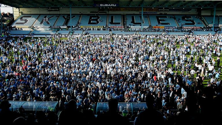 COVENTRY, ENGLAND - APRIL 30:  Coventry City fans on the pitch at the end of the Coca-Cola Championship match between Coventry City and Derby County at Highfield Road on April 30, 2005 in Coventry, England.  (Photo by Paul Gilham/Getty Images)
