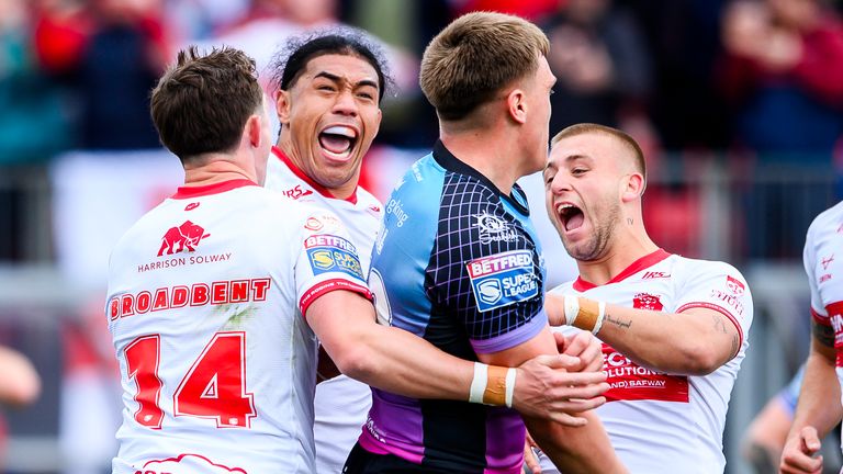 Picture by Allan McKenzie/SWpix.com - 03/04/2026 - Rugby League - Betfred Super League Round 7 - Hull KR v Hull FC - Sewell Group Craven Park, Hull, England - Hull KR's Jack Broadbent is congratulated on his try against Hull FC by Tom Amone (l) and Mikey Lewis (r).